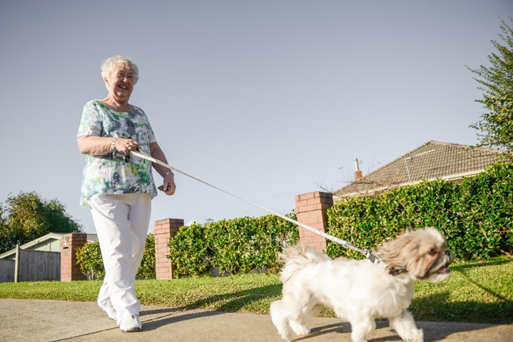 Mobile Medical Alarm customer walking dog