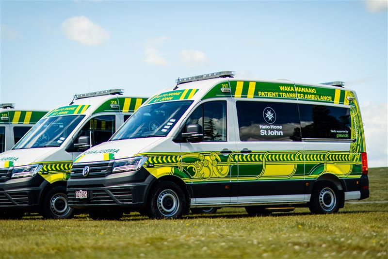 Two paramedics in the front of an ambulance